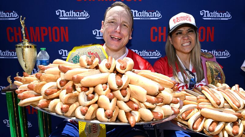 Joey Chestnut, left, and Miki Sudo, last year’s hot dog eating contest winners (Major League Eating/PA)