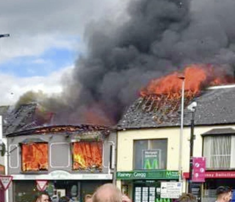 The blaze on Broughshane Street in Ballymena began in the Woodgreen furniture store at around 5pm on Tuesday and the flames spread to neighbouring premises 