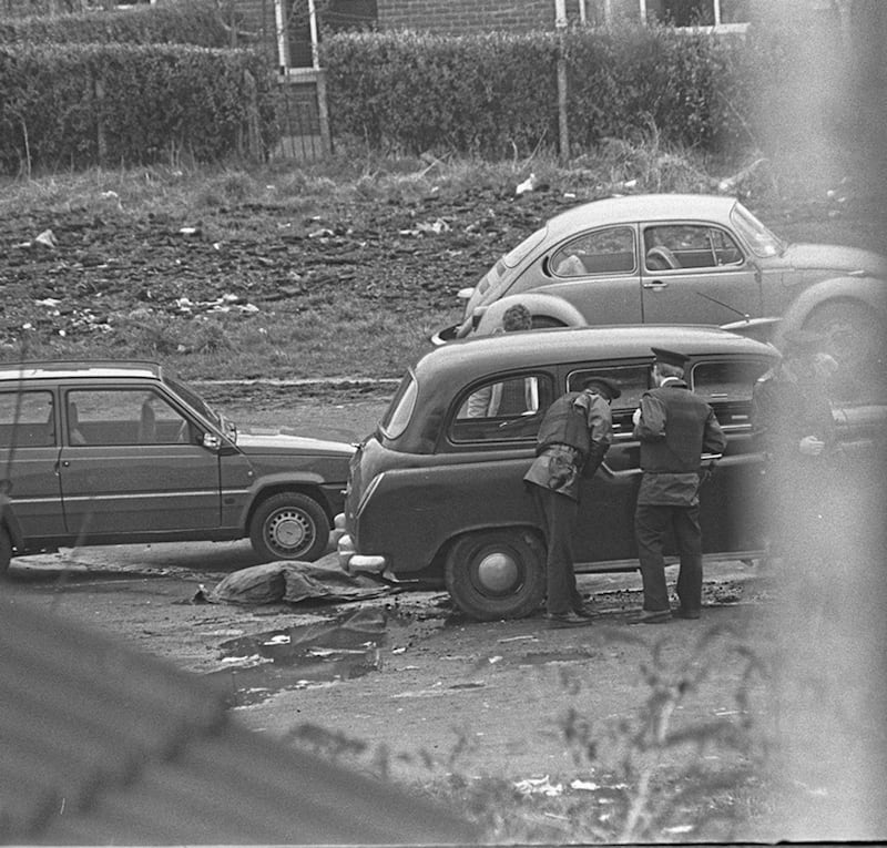 The bodies of Corporals David Howes and Derek Wood on waste ground at 'Penny Lane' in Andersonstown after they were shot dead by the IRA.