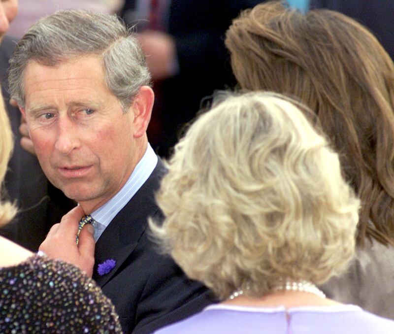 The Prince of Wales looks around at Camilla Parker Bowles (right) at the National Osteoporosis Society’s 15th Birthday Celebrations at Somerset House, London