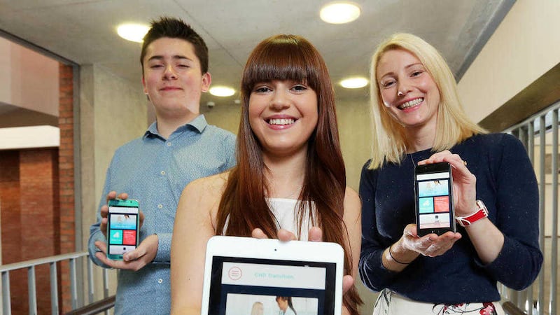 Children&#39;s Heartbeat Trust chief executive Sarah Quinlan, right, with Eoin Bogue (15) from Tyrone and Hollie Rodgers (16) from Derry at the launch of the CHD app and book 