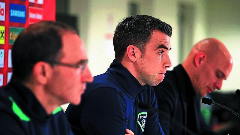 Seamus Coleman speaks to the media in Vienna last night as manager Martin O&rsquo;Neill listens on, while, above, the Republic of Ireland skipper goes through his stretches in the Ernst Happel Stadium ahead of tonight&rsquo;s crucial World Cup qualifier