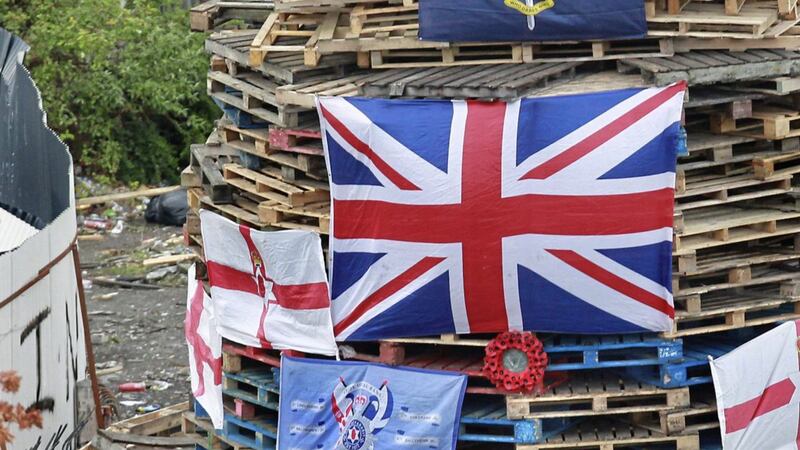 Stolen poppy wreaths on a republican bonfire built in the Bogside area of Derry which was burnt last week on August 15. A new report has warned of deteriorating relationships between police and some communities in the city. Picture by Margaret McLaughlin 