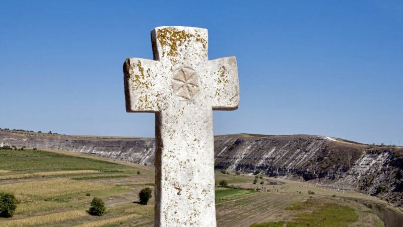 An ancient stone cross at a monastery in Orhei Vechi, Moldova 