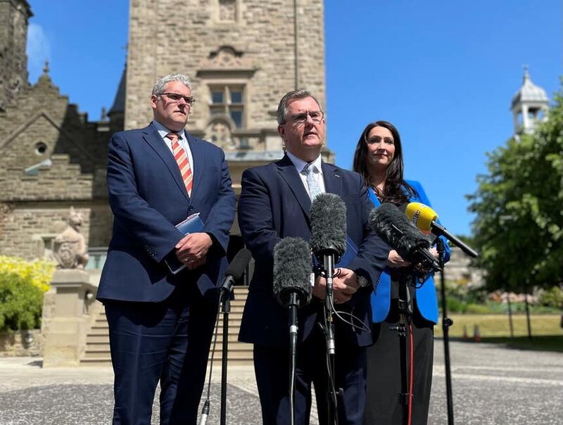 DUP leader Sir Jeffrey Donaldson along with party colleagues Gavin Robinson and Emma Little Pengelly outside Stormont Castle