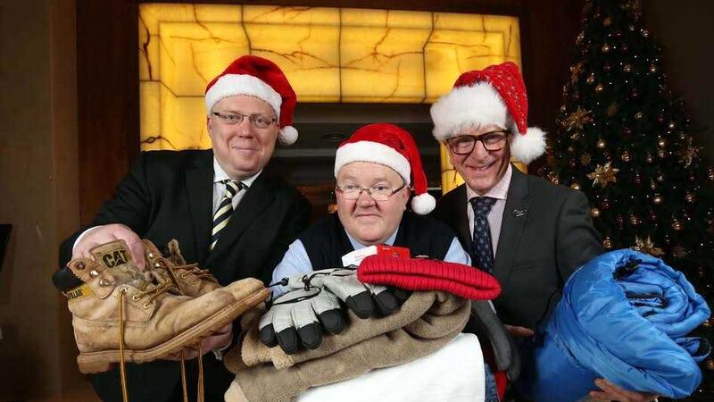 Peter McVerry from U105, Paul Doyle from Translink and James McGinn from Hastings Hotels are appealing for the public to donate clothes and toiletries to the homeless at Christmas