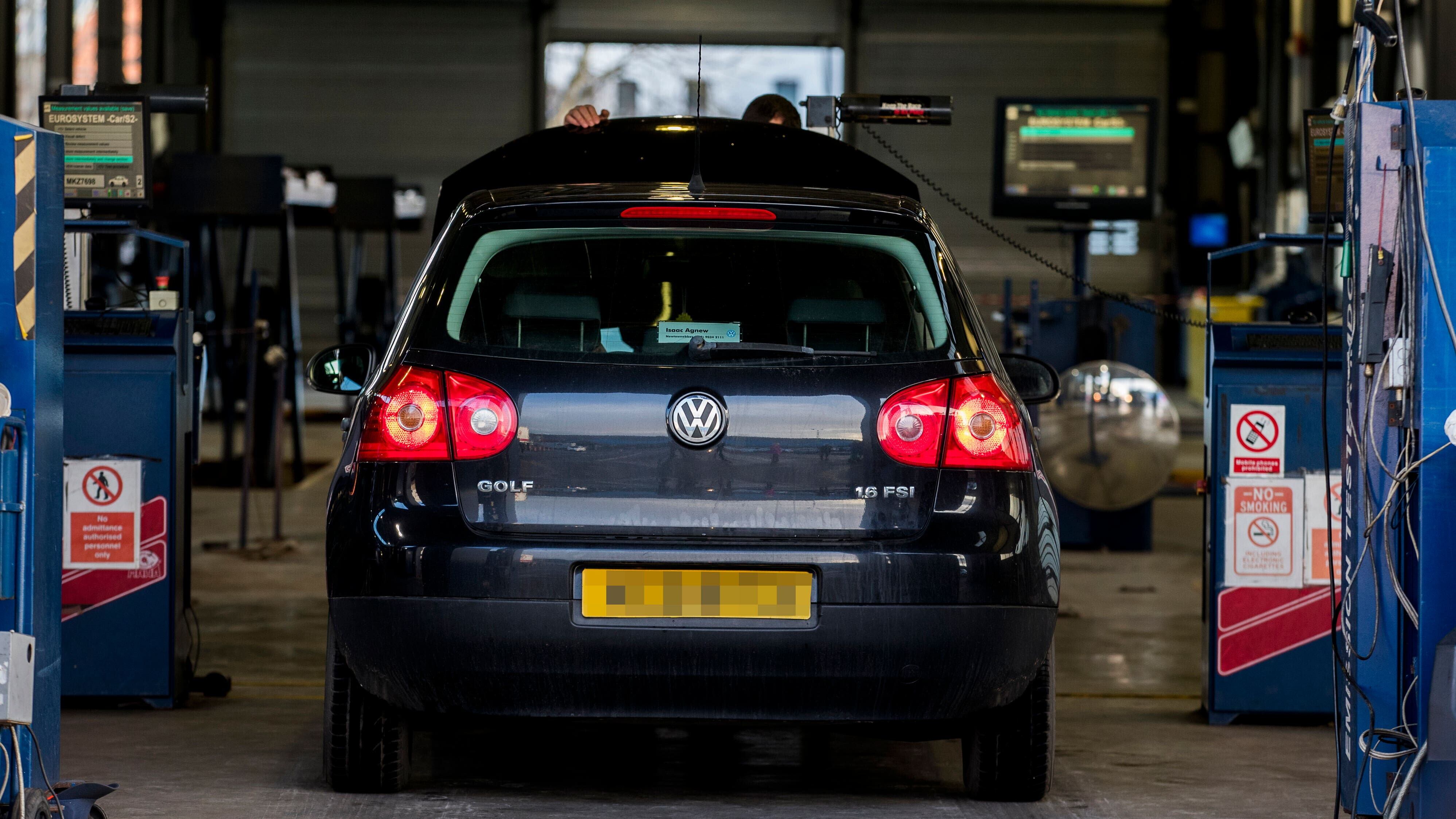 A vehicle during its MOT test (PA)