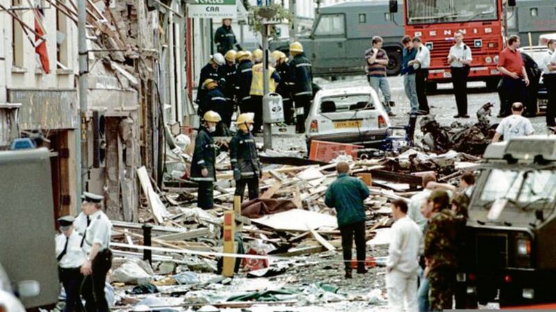 Rescue workers and police search for survivors following the Omagh bombing in 1998 