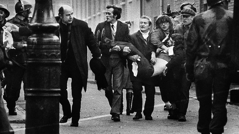 Fr Edward Daly, later Bishop of Derry, clears a path for a man badly injured during Bloody Sunday in Derry on January 30 1972.