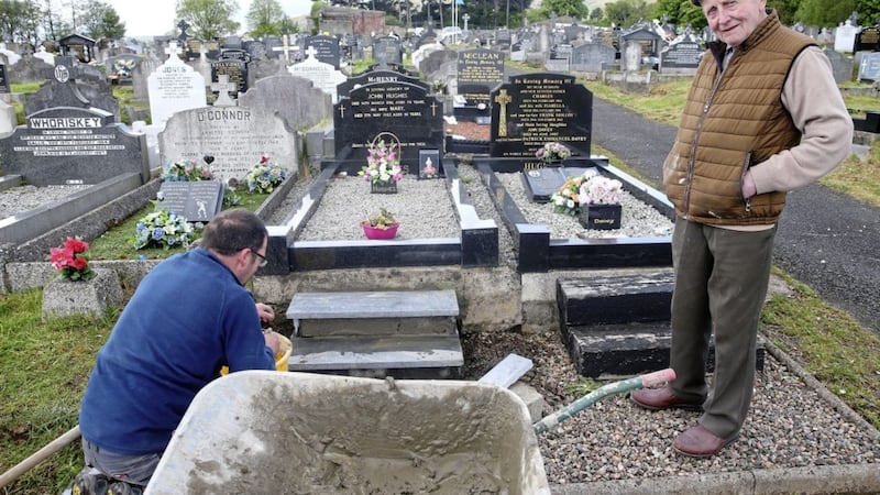 John Hughes (91) formerly of Hannahstown and now Co Louth tends to a family grave in Milltown ahead of Cemetery Sunday. Picture by Mal McCann 