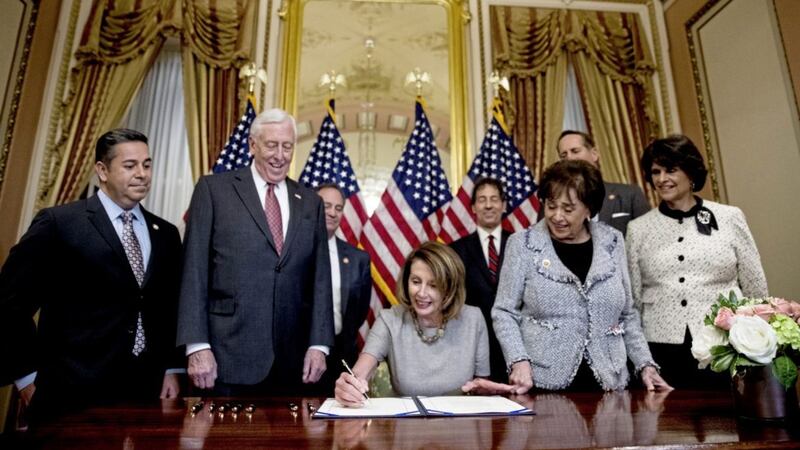 House Speaker Nancy Pelosi signs a deal to reopen the government on Capitol Hill in Washington, thus ending the US shut-down 