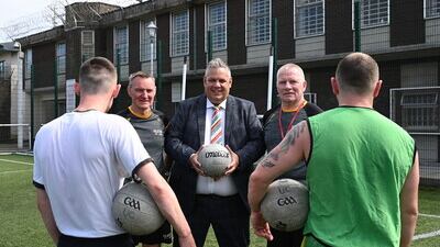 Maghaberry Prison has teamed up with Ulster GAA to coach skills for Gaelic football to prisoners as part of a sports rehabilitation initiative. Maghaberry Governor David Savage (centre) is pictured with Ulster GAA coaches Roger Keenan and Tony Scullion. Picture: Michael Cooper.