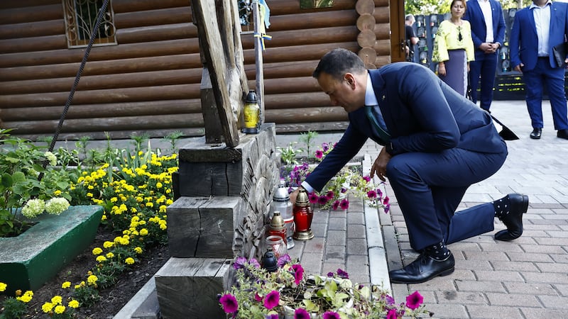 Taoiseach Leo Varadkar lights a candle during a visit to the memorial to the Heavenly Hundred at Maidan Square, Kyiv (PA/Clodagh Kilcoyne)