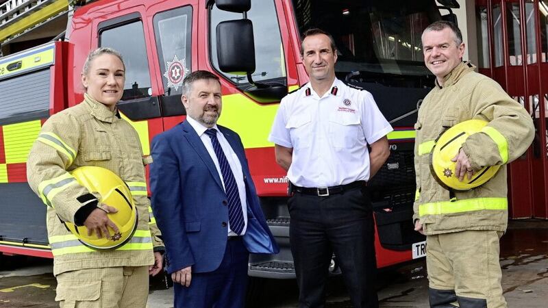 Health Minister Robin Swann with NIFRS chief fire and rescue officer Andy Hearn and Crew Commanders Lynsey Miller and Jonny Caughey 