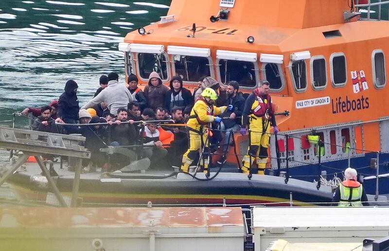 A group of people thought to be migrants are brought in to Dover, Kent, on board the RNLI Dover Lifeboat