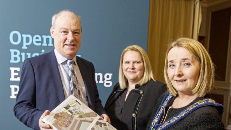 Newry, Mourne and Down District Council&#39;s chief executive Liam Hannaway, enterprise trade and tourism director Marie Ward and chair Councillor Ro&iacute;s&iacute;n Mulgrew look at images of the proposed sites. Photo: NewRayPics.com 