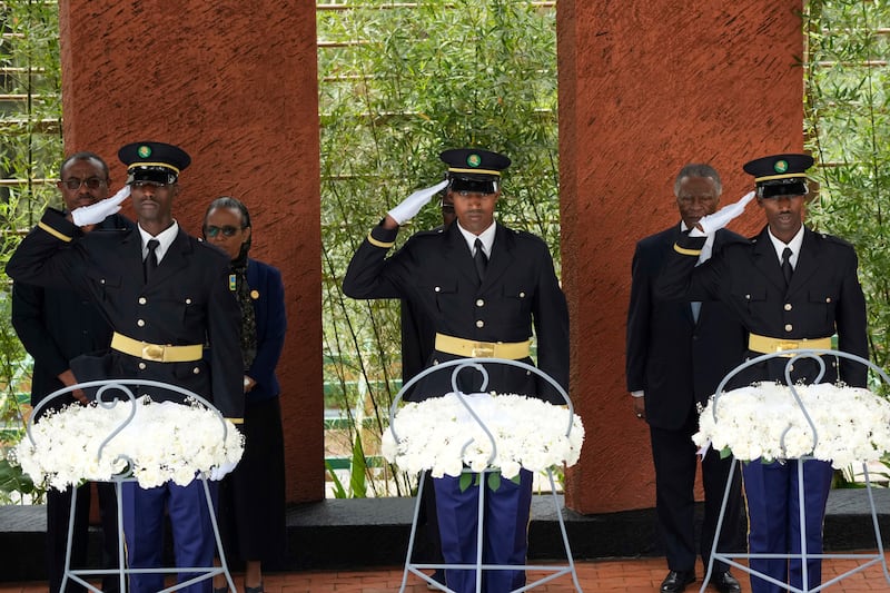 Rwandan military personnel salute as dignitaries lay wreaths at the Kigali Genocide Memorial (Brian Inganga/AP)