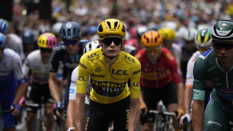Denmark's Jonas Vingegaard, wearing the overall leader's yellow jersey, and Belgium's Jasper Philipsen (right), wearing the best sprinter's green jersey, right, ride during the ceremonial parade of the 11th stage of the Tour de France Picture by AP Photo/Daniel Cole