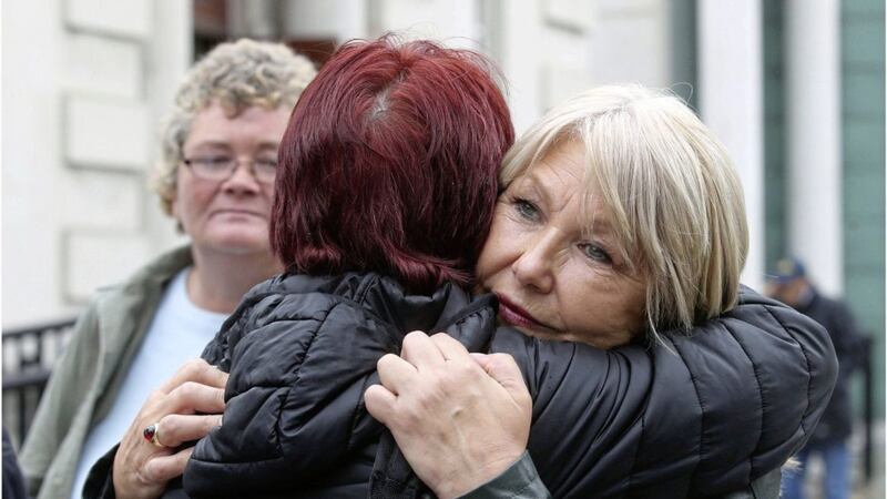 &nbsp;Margaret McGuckin (right) of Survivors and Victims of Institutional Abuse (Savia) leaves the High Court in Belfast after a legal challenge against a failure to compensate victims was put back. Picture by Hugh Russell