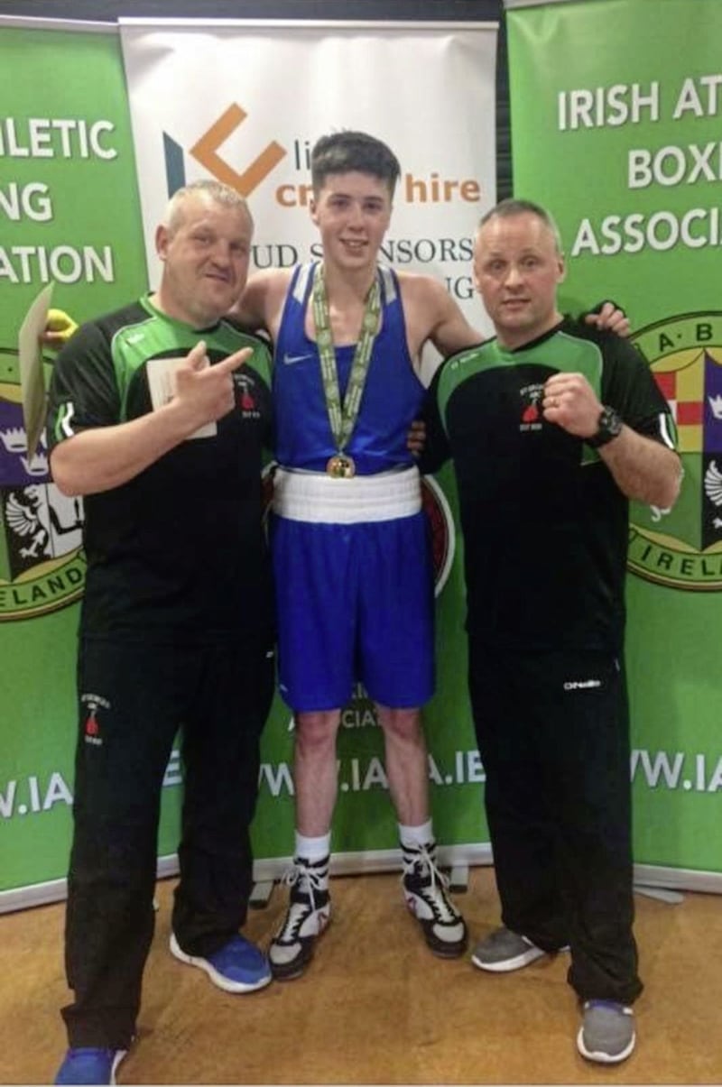 Jack McGivern with St George&#39;s coach Danny Boyd (left) and dad/coach Jim McGivern after his Irish title win in March 