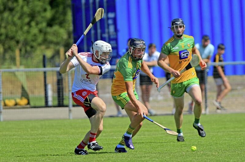 24/7/2021  Tyrones   Conor Grogan     in action with Donegals   Conor O Grady     in Saturdays Nicky Rackard Hurling  Semi Final game at Carrickmore      Picture  Seamus  Loughran. 
