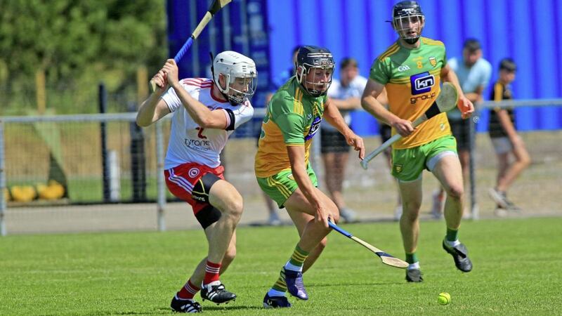 24/7/2021  Tyrones   Conor Grogan     in action with Donegals   Conor O Grady     in Saturdays Nicky Rackard Hurling  Semi Final game at Carrickmore      Picture  Seamus  Loughran. 