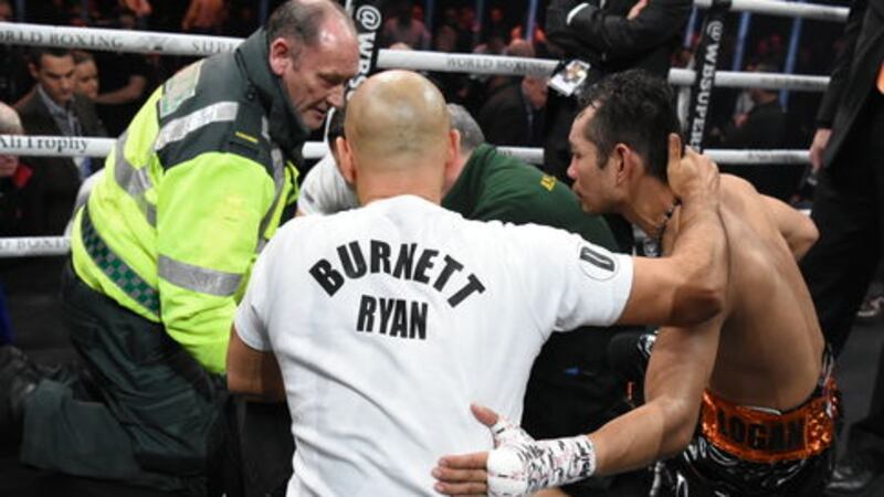 Nonito Donaire talks to Ryan Burnett and Nonito Donaire in the corner after the Belfast man was forced to retire on his stool at the end of the fourth round. Picture by Jennifer Charlton