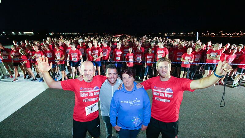Richard Gillan, Managing Partner of Grant Thornton in Northern Ireland, Gail McKee of charity partner Make-A-Wish Foundation and event ambassador Chris Henry, Ulster Rugby star, join runners at the starting line at last night&rsquo;s Grant Thornton Runway Run at Belfast City Airport&nbsp;