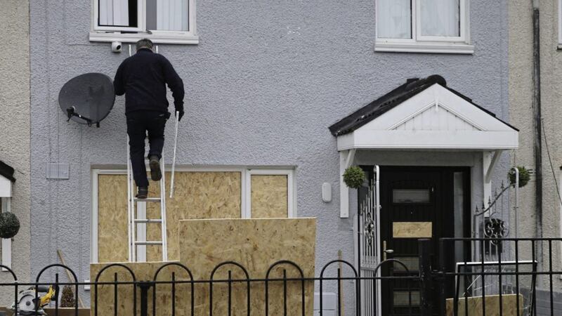 Windows were boarded up at a home in the Shankill area of Belfast after an attack on Monday evening 