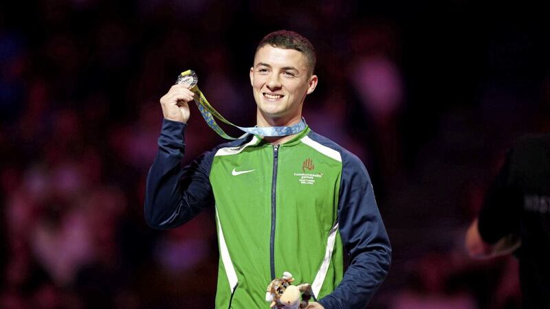 Team NI gymnast Rhys McClenaghan receives his silver medal during yesterday&#39;s ceremony after the men&#39;s pommel horse final at Arena Birmingham. Picture by PA 