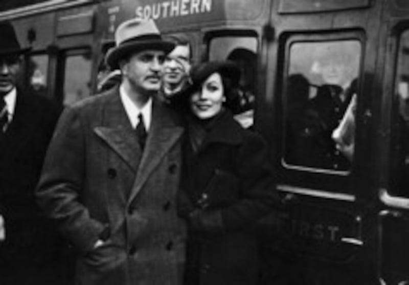 MGM art director and designer of the Oscar trophy, Cedric Gibbons (1893 - 1960) arriving at Waterloo station in London in April 1936 with his wife, Hollywood film star, Dolores Del Rio. (Photo by H. Allen/Topical Press Agency/Getty Images)