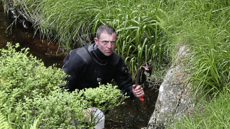 Members of the Garda water unit searches the River Vartry in the Wicklow Mountains after parts of the dismembered body of Patricia O&#39;Connor were found 