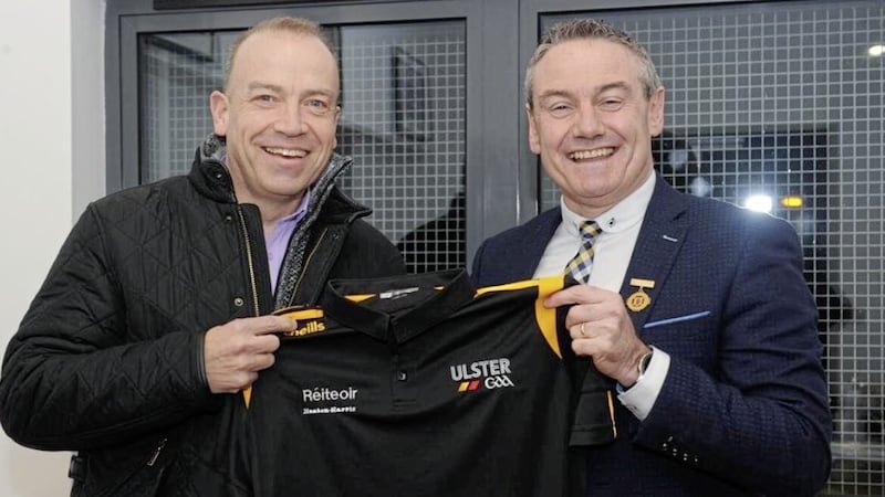 Northern Ireland Secretary Chris Heaton-Harris is presented with a jersey by Ulster GAA President Ciaran McLaughlin 