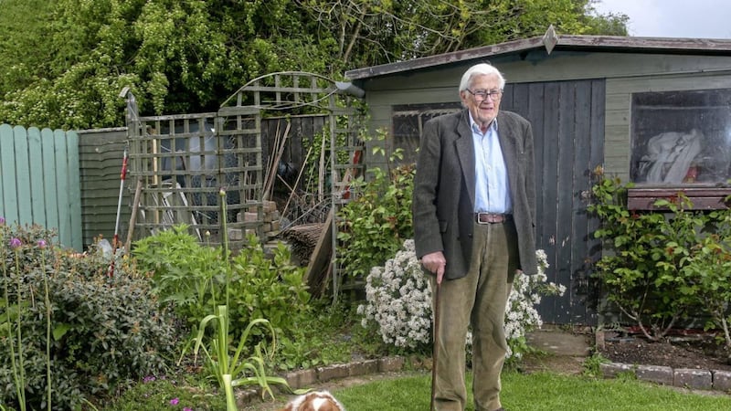 Former Deputy Leader of the SDLP Seamus Mallon pictured in his garden with his pet pooch Jessie. Picture by Mal McCann. 