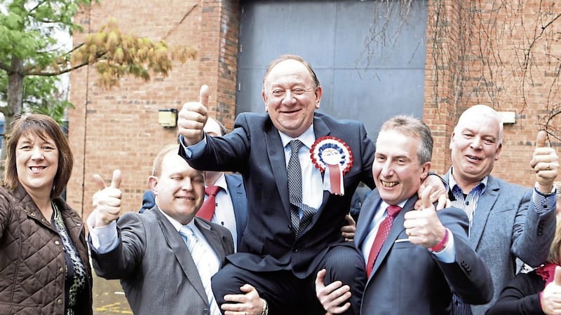 WINNERS AND LOSERS: Above, the DUP&rsquo;S William Irwin celebrates topping the poll in Newry and Armagh. Left, Sinn F&eacute;in&rsquo;s Cathal Boylan was elected on the first count. Far left, Danny Kennedy&rsquo;s 32-year career in politics has ended 	              		       PictureS: Matt Bohill 
