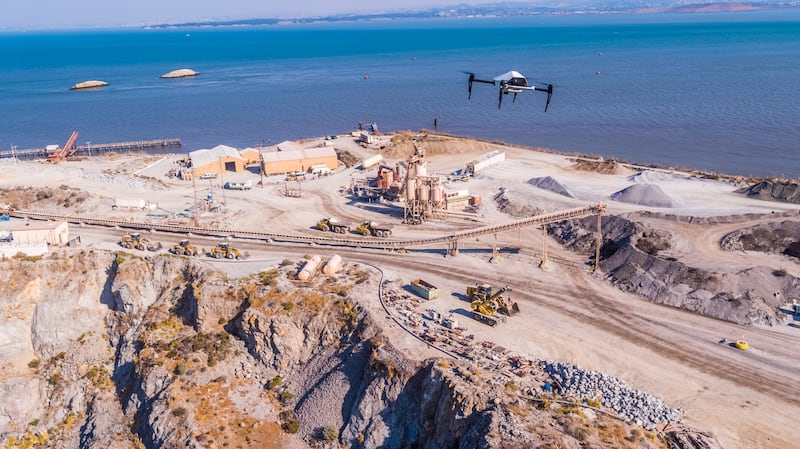 Explore 1 drone midflight above a construction site (DJI/Skycatch)