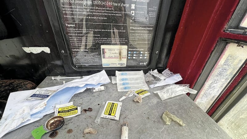 Used needles inside a phone box on North Street in Belfast. Picture by Hugh Russell 