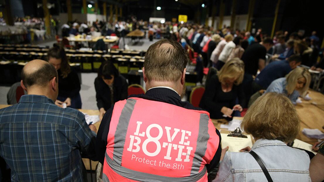 A No campaigner wearing a Love Both vest watches as votes are counted at Dublin's RDS. Picture by Brian Lawless/PA Wire
