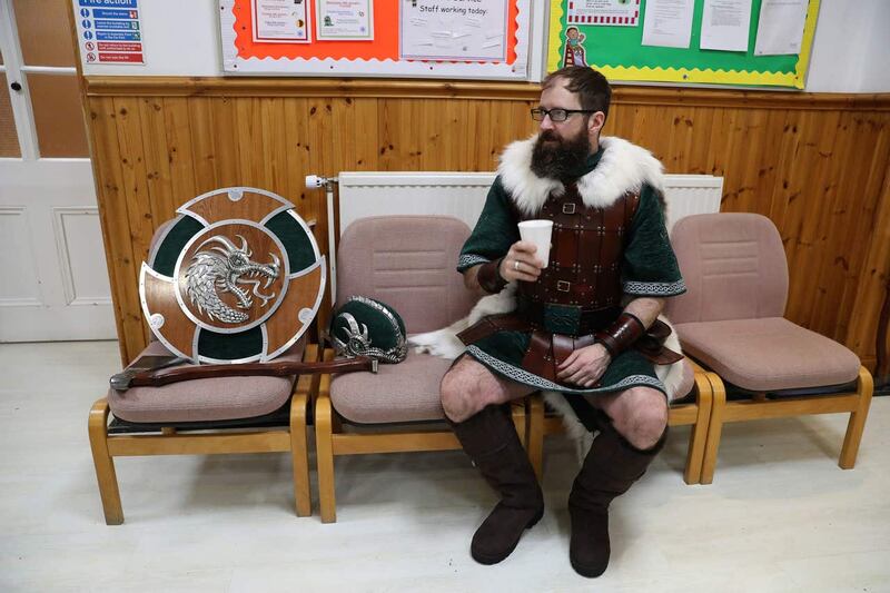 Jarl Squad member David Simpson has a cup of tea before marching through Lerwick on the Shetland Isles during the Up Helly Aa Viking festival