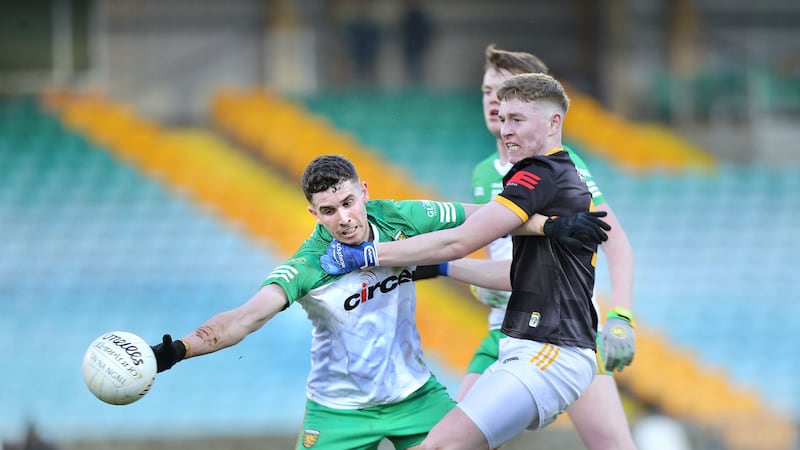 Donegal’s Christy Mulligan and Conor Hand of Antrim battle for possession Picture by Margaret McLaughlin