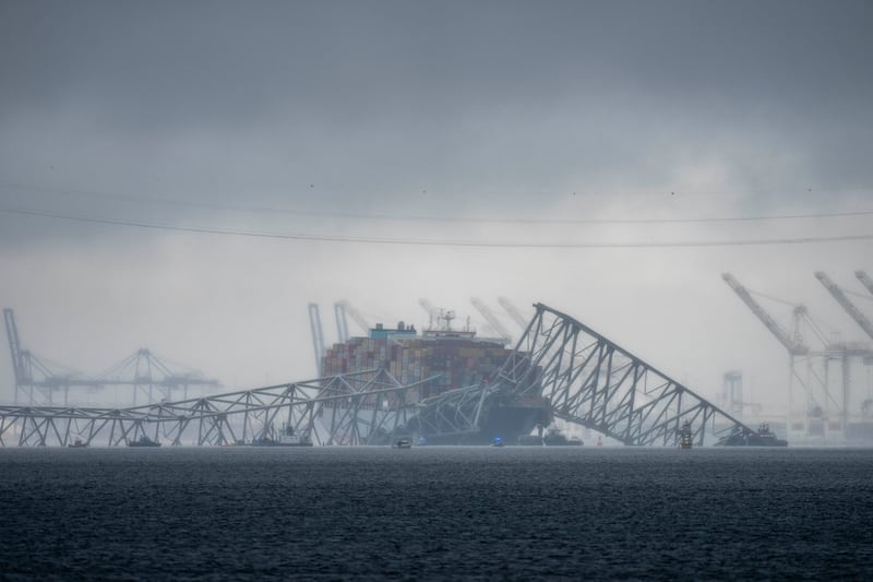 Clouds float over the Patapsco River near the container ship Dali as it rests against the wreckage of the Francis Scott Key Bridge in Baltimore (Alex Brandon/AP)