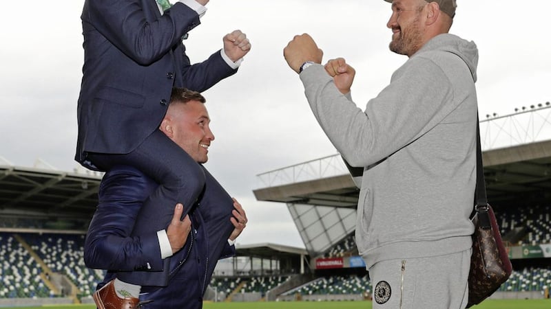 Carl Frampton lifts Paddy Barnes up for a picture with Tyson Fury during the press conference at Windsor Park, Belfast 