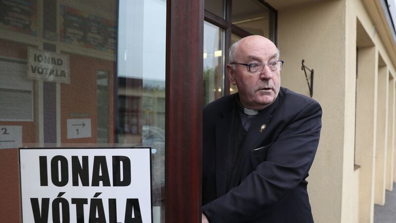 Father Tom Harrington arrives at the polling station in Knock National school, Mayo, as the country goes to the polls to vote in the referendum on the 8th Amendment of the Irish Constitution&nbsp;