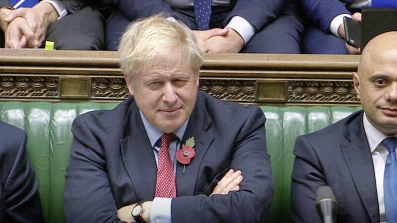 Prime Minister Boris Johnson listens to Labour leader Jeremy Corbyn speaking in the House of Commons as a vote on a December general election is debated Picture by House of Commons/PA 