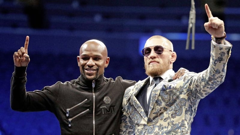 Floyd Mayweather Jr and Conor McGregor pose during a news conference after their super welterweight bout in Las Vegas. Picture by Isaac Brekken, AP 