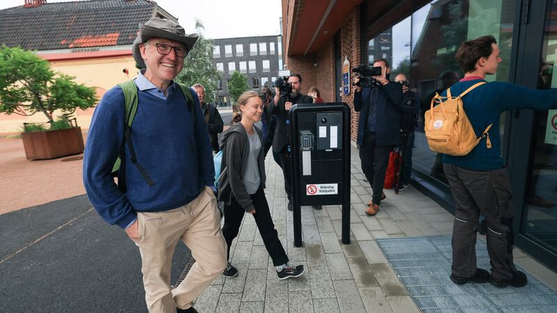 Climate activist Greta Thunberg, centre, arrives at court (Andreas Hillergren/ TT News Agency/AP)