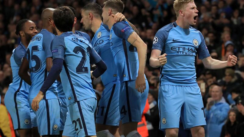 Manchester City's Kevin De Bruyne (right) celebrates with team-mates after scoring his side's second goal in Tuesday's match against Barcelona<br />Picture by PA