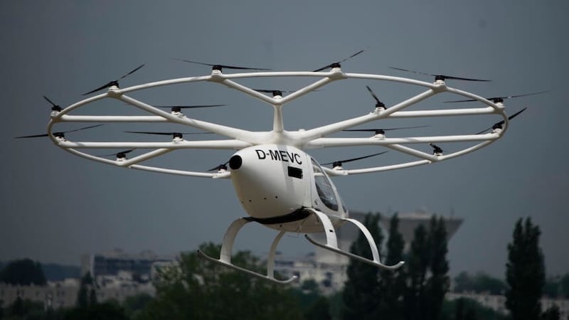 The Volocopter 2X, an electric vertical takeoff and landing multicopter, performs a demonstration flight during the Paris Air Show in Le Bourget (AP)
