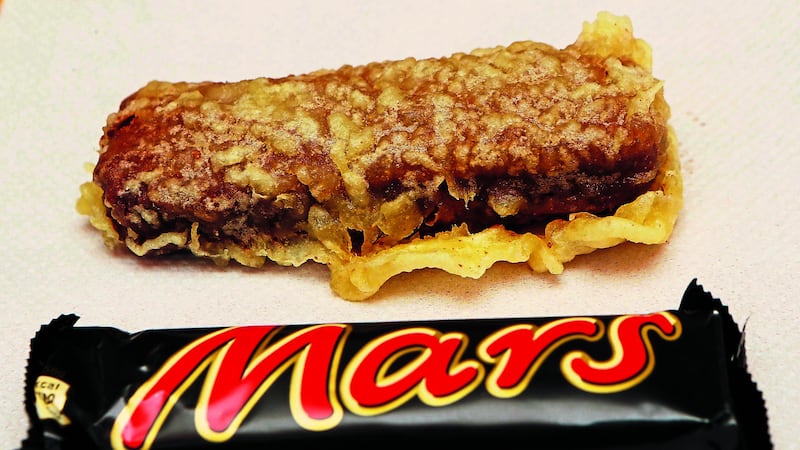 <b style="font-family: 'ITC Franklin Gothic'; ">&lsquo;WORLD FAMOUS&rsquo;: </b><span style="font-family: 'ITC Franklin Gothic'; ">The Carron Fish Bar in Stonehaven, Aberdeenshire, advertises itself as the &lsquo;birthplace of the world famous deep-fried Mars bar&rsquo; with a large sign on the side of the shop</span><b style="font-family: 'ITC Franklin Gothic'; ">&nbsp;<span class="Apple-tab-span" style="white-space:pre">				</span>&nbsp;&nbsp;</b>