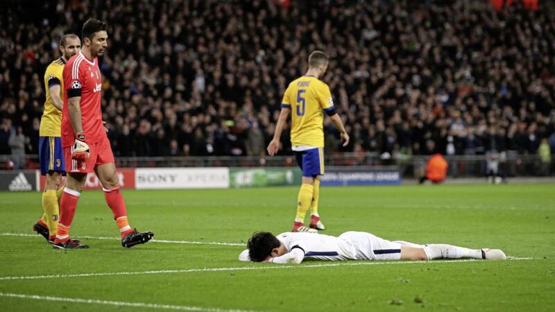 Tottenham Hotspur&#39;s Son Heung-Min lies dejected after a missed chance 